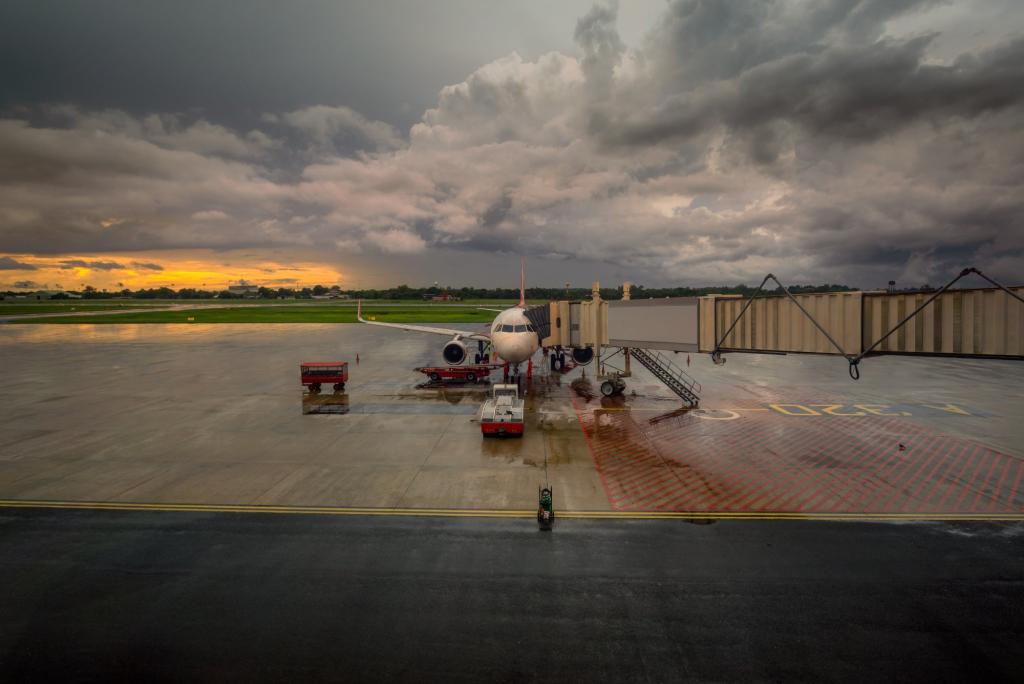 Airport operations crew leaving the ramp as a thunderstorm approaches