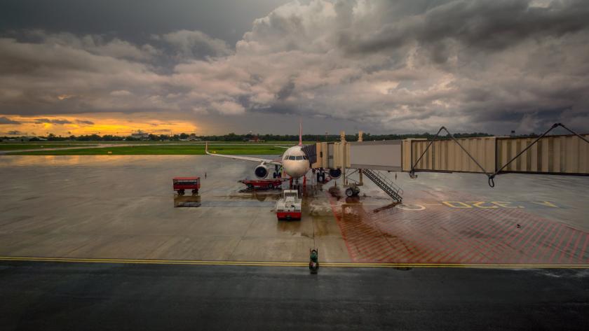 Airport operations crew leaving the ramp as a thunderstorm approaches