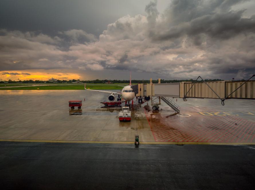 Airport operations crew leaving the ramp as a thunderstorm approaches